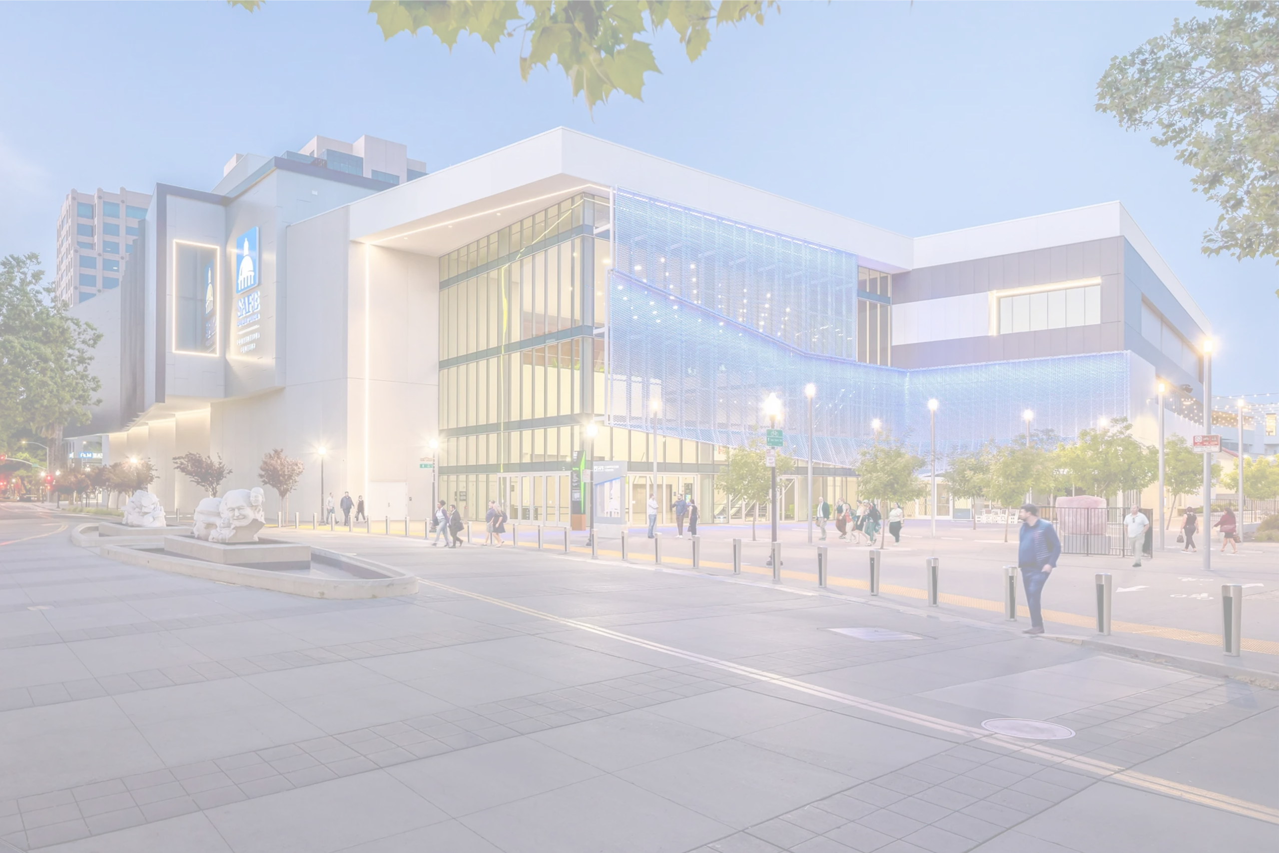SAFE Credit Union Convention Center exterior in Sacramento, illuminated at dusk, where Smart City Networks provides technology and connectivity services.