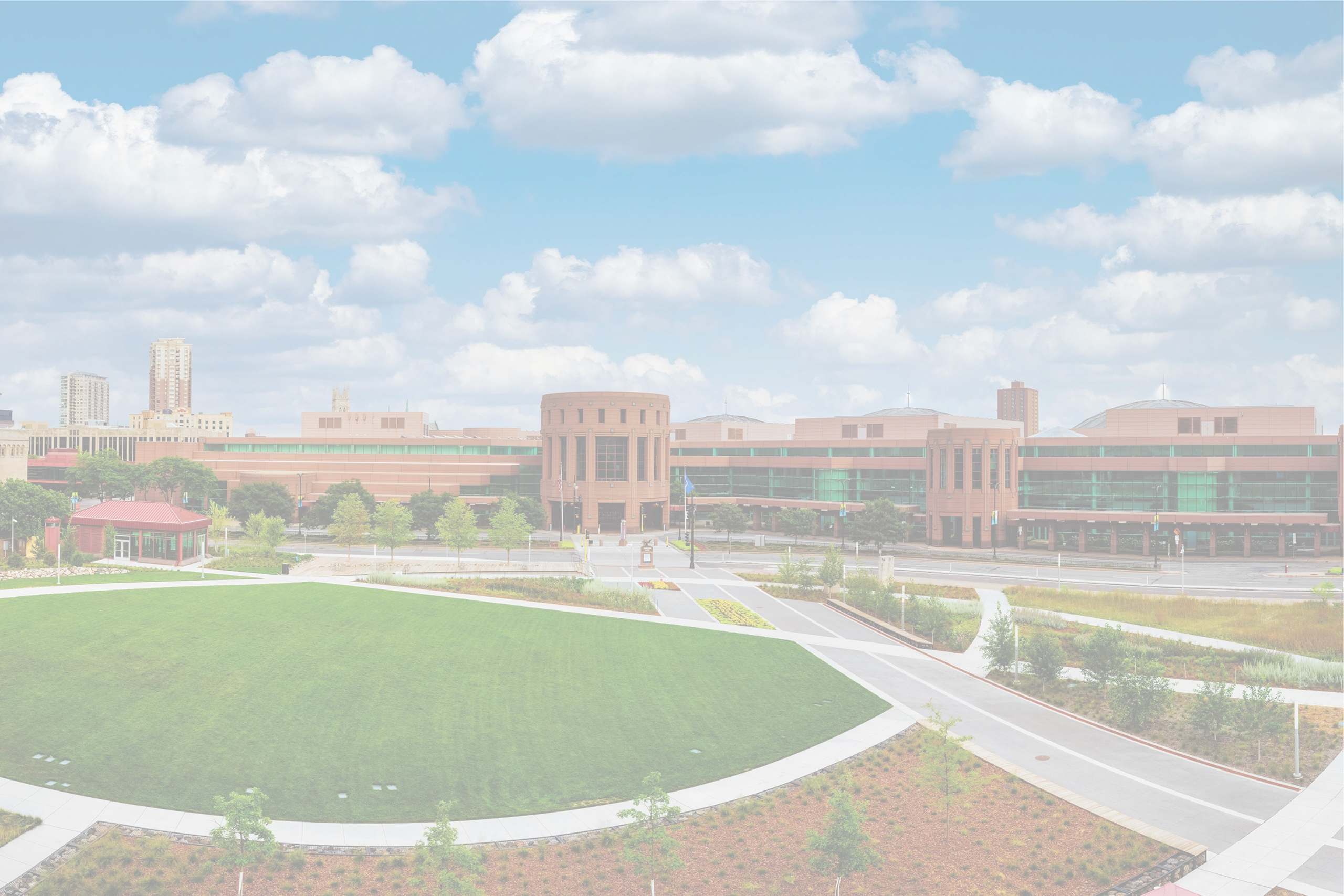 Minneapolis Convention Center exterior with curved architecture and green spaces, supported by Smart City Networks for technology services.